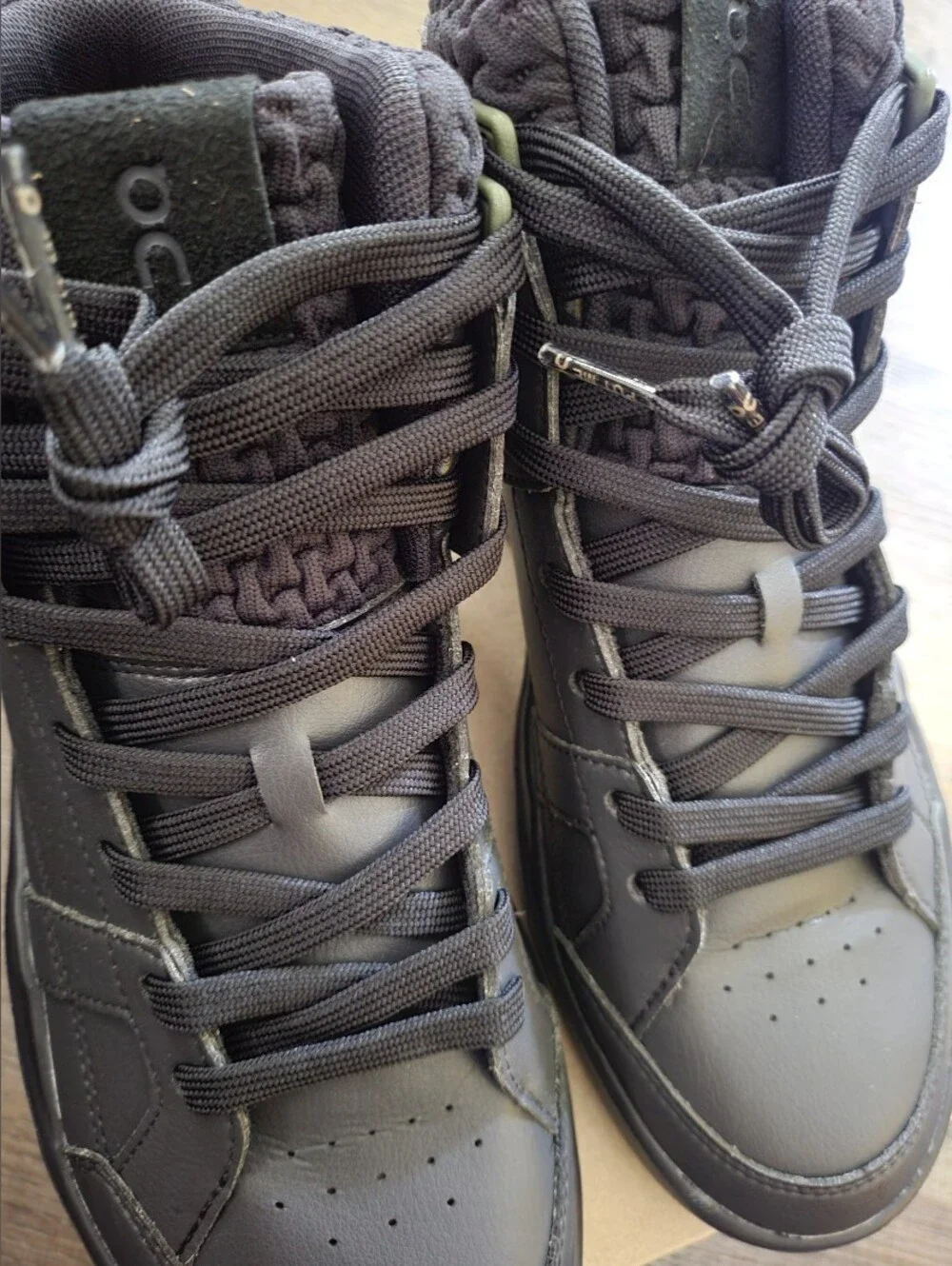 On Running Black High-Top Athletic Shoes with Olive Accents